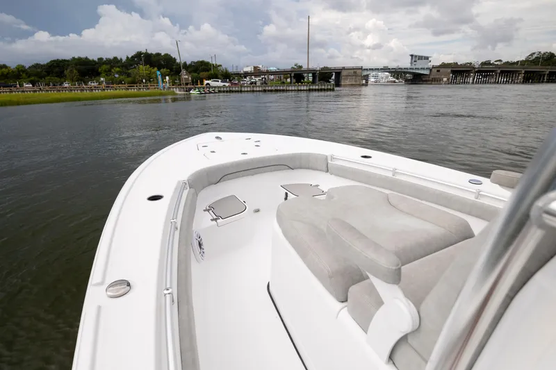 Slide: The Image of 2020 Sportsman Masters 267OE Bay Boat on calm water near a bridge. - 17