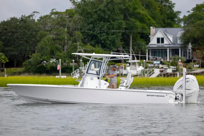 Slide: The Image of 2020 Sportsman Masters 267OE Bay Boat cruising on a scenic waterway. - 2