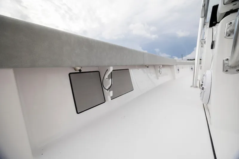 Slide: The Image of 2020 Sportsman Masters 267OE Bay Boat interior, featuring sleek white design and modern fittings. - 24