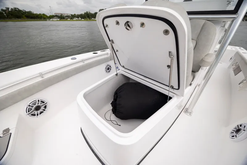 Slide: The Image of 2020 Sportsman Masters 267OE Bay Boat with open storage compartment on deck. - 27