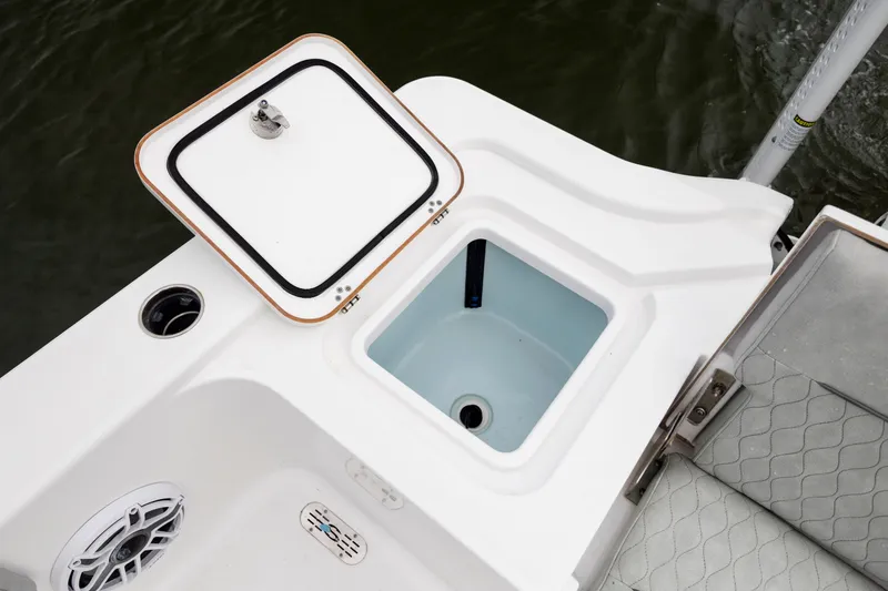 Slide: The Image of 2020 Sportsman Masters 267OE Bay Boat with open storage compartment and speaker. - 28