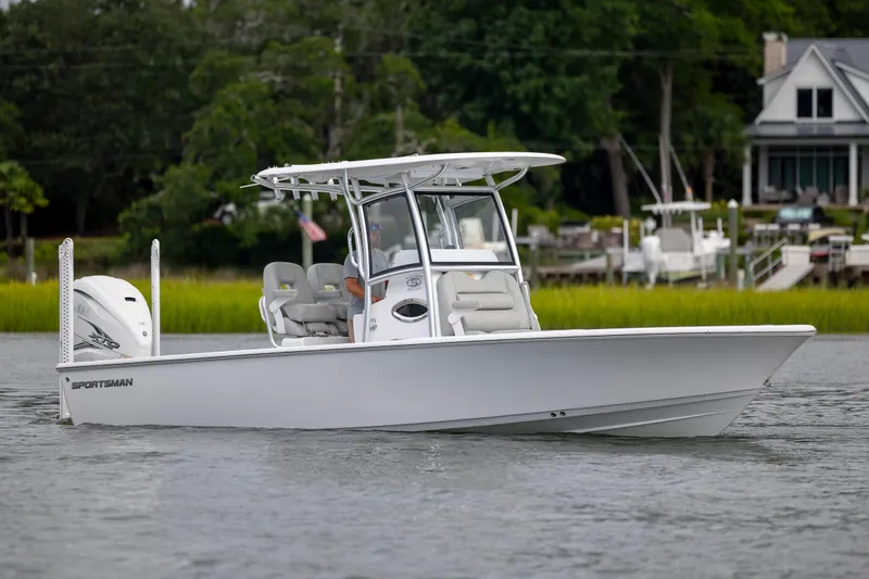 Slide: The Image of 2020 Sportsman Masters 267OE Bay Boat on calm water near shoreline. - 5