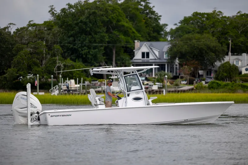 Slide: The Image of 2020 Sportsman Masters 267OE Bay Boat cruising on a scenic waterway. - 6