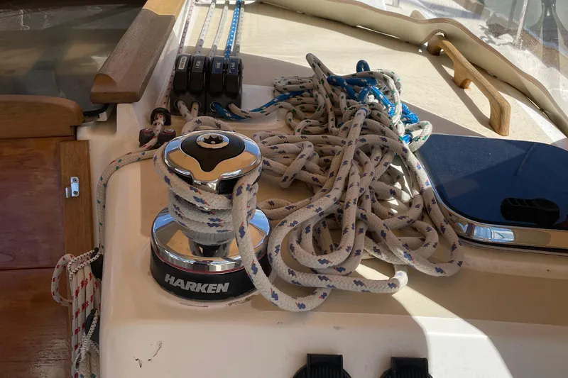 Slide: The Image of Sailboat deck with ropes and winch on a 2004 Tartan 3700. - 11