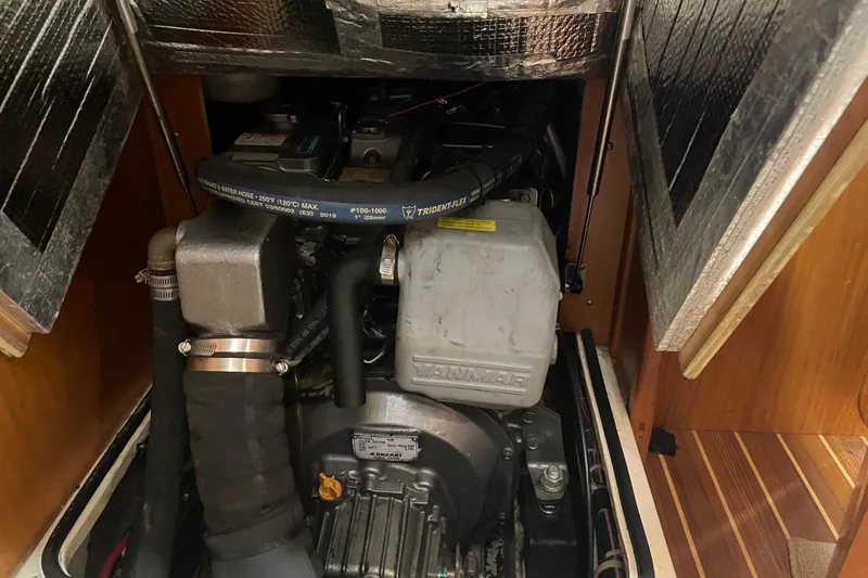 Slide: The Image of Engine compartment of a 2004 Tartan 3700 sailboat, featuring a Yanmar engine. - 20