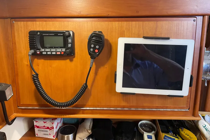 Slide: The Image of Boat interior with mounted radio and tablet on wooden panel, Tartan 3700, 2004 model. - 28