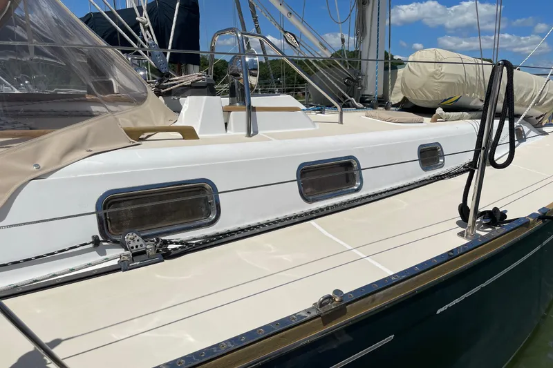 Slide: The Image of Tartan 3700 sailboat from 2004, featuring sleek deck design and modern fittings. - 4