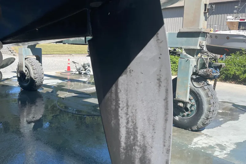 Slide: The Image of Tartan 3700 sailboat keel and wheels in a boatyard, 2004 model. - 40