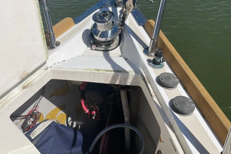 Slide: The Image of Bow of 2004 Tartan 3700 sailboat with anchor winch and storage compartment. - 5