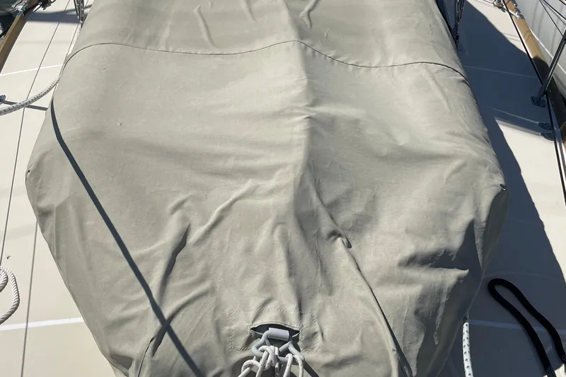 Slide: The Image of Covered deck of a 2004 Tartan 3700 sailboat with ropes and canvas. - 7