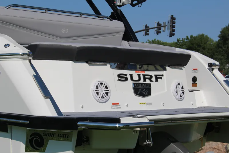 Slide: The Image of 2025 Cobalt R4 Surf boat rear view with speakers and Surf Gate feature. - 18