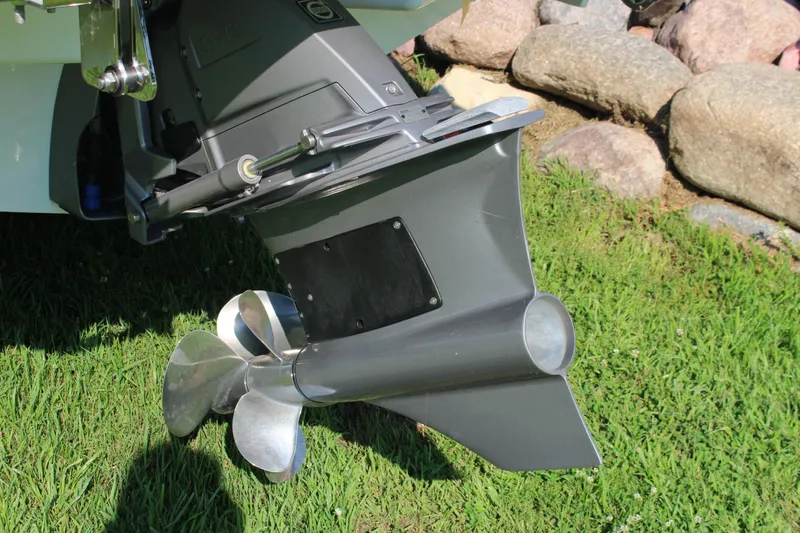 Slide: The Image of 2025 Cobalt R4 Surf boat propeller on grass, showcasing sleek design and engineering. - 20