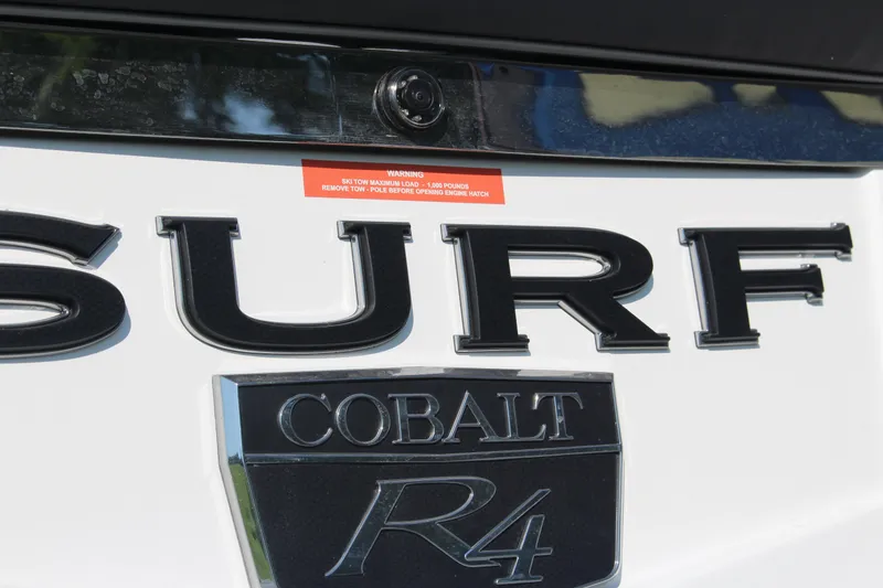 Slide: The Image of 2025 Cobalt R4 Surf boat emblem with warning label visible. - 21