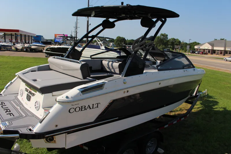 Slide: The Image of 2025 Cobalt R4 Surf boat on display, featuring sleek design and modern amenities. - 22