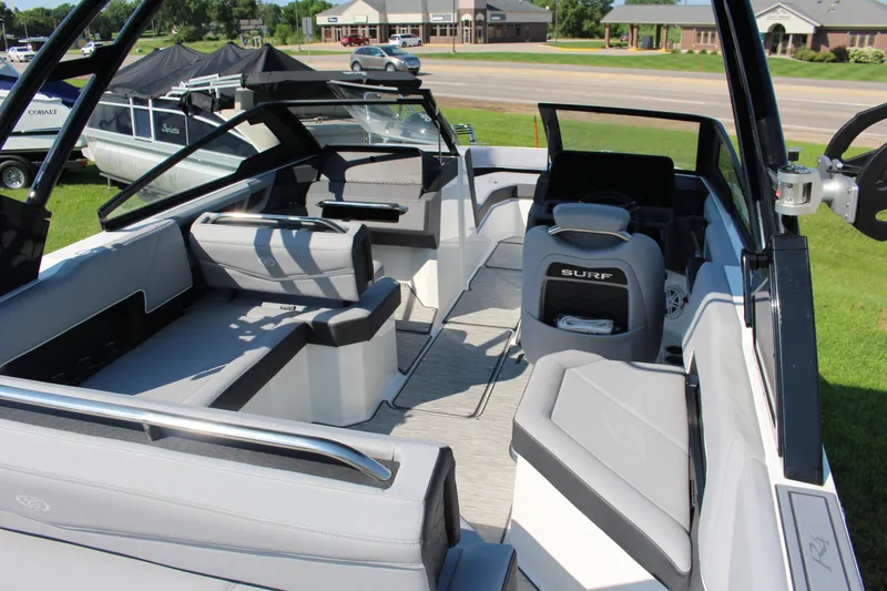 Slide: The Image of 2025 Cobalt R4 Surf boat interior with sleek seating and modern design. - 25
