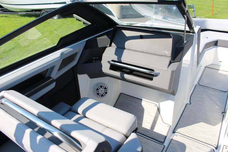 Slide: The Image of 2025 Cobalt R4 Surf boat interior with sleek seating and modern dashboard design. - 26