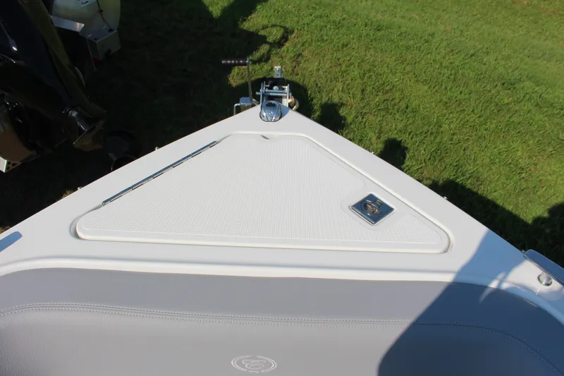 Slide: The Image of 2025 Cobalt R4 Surf boat bow with sleek design on grass. - 29