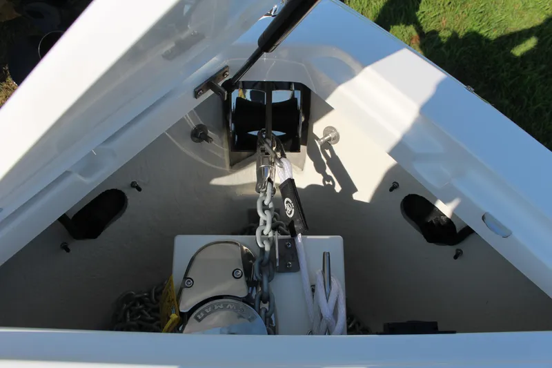 Slide: The Image of Anchor compartment of 2025 Cobalt R4 Surf boat, featuring chain and winch system. - 30