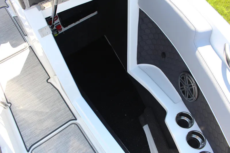 Slide: The Image of 2025 Cobalt R4 Surf boat interior with cup holders and speaker detail. - 31