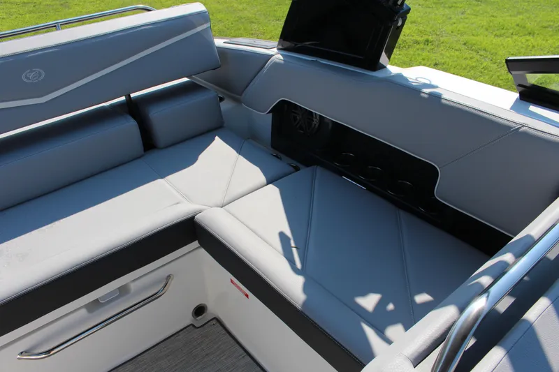 Slide: The Image of 2025 Cobalt R4 Surf boat interior with sleek gray seating and modern design. - 38