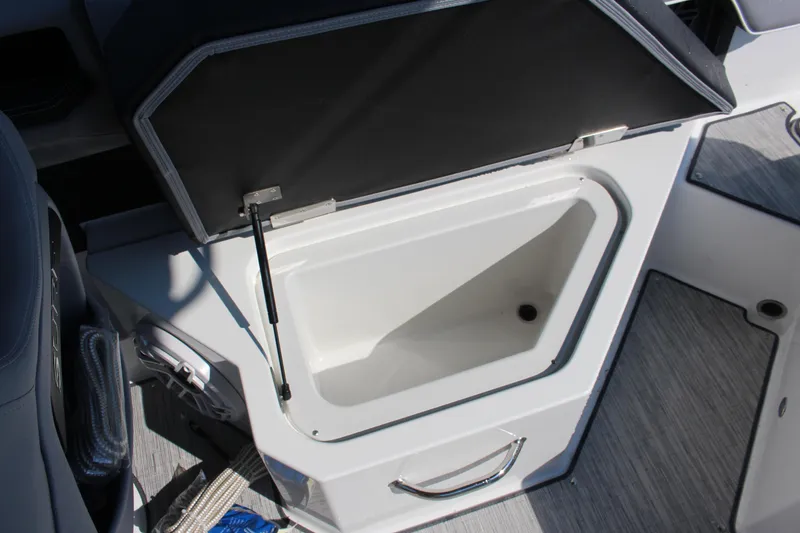 Slide: The Image of Open storage compartment in 2025 Cobalt R4 Surf boat interior. - 40