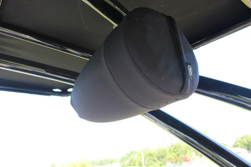 Slide: The Image of Black speaker cover on 2025 Cobalt R4 Surf boat frame. - 43