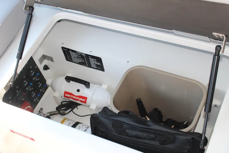 Slide: The Image of Storage compartment in 2025 Cobalt R4 Surf boat with Metrovac equipment and accessories. - 45