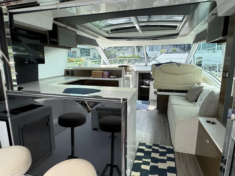 Slide: The Image of Luxurious interior of 2017 Cruisers Yachts 45 Cantius with modern seating and sleek design. - 15