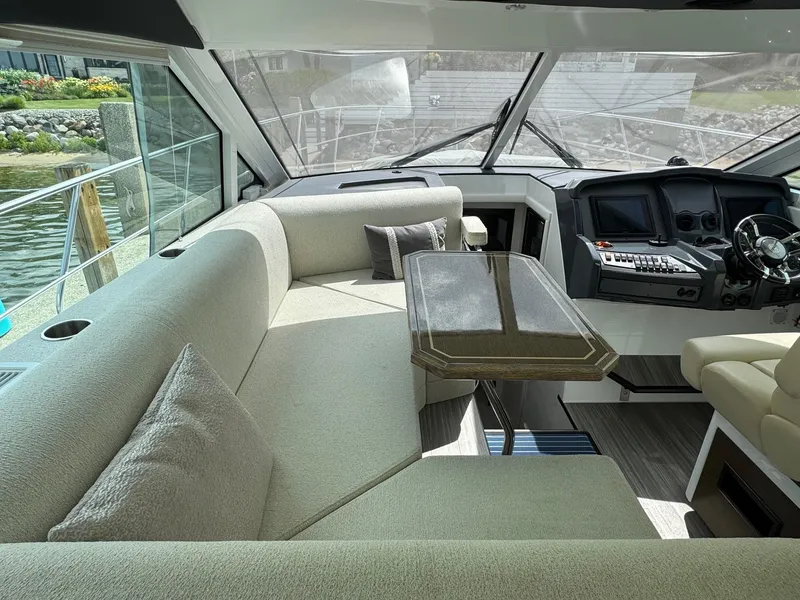 Slide: The Image of Luxurious interior of 2017 Cruisers Yachts 45 Cantius with plush seating and modern helm. - 18