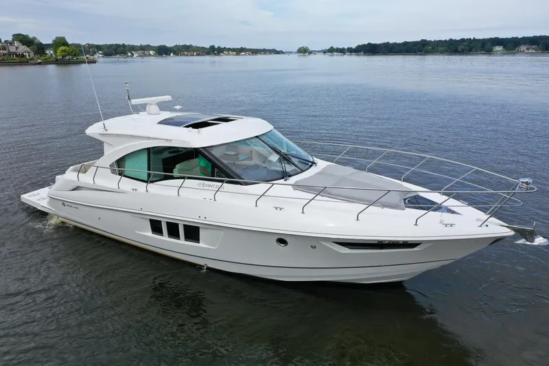 Slide: The Image of 2017 Cruisers Yachts 45 Cantius luxury boat on calm water, side view. - 2