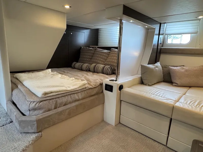Slide: The Image of Luxurious interior of 2017 Cruisers Yachts 45 Cantius with cozy bed and seating area. - 31
