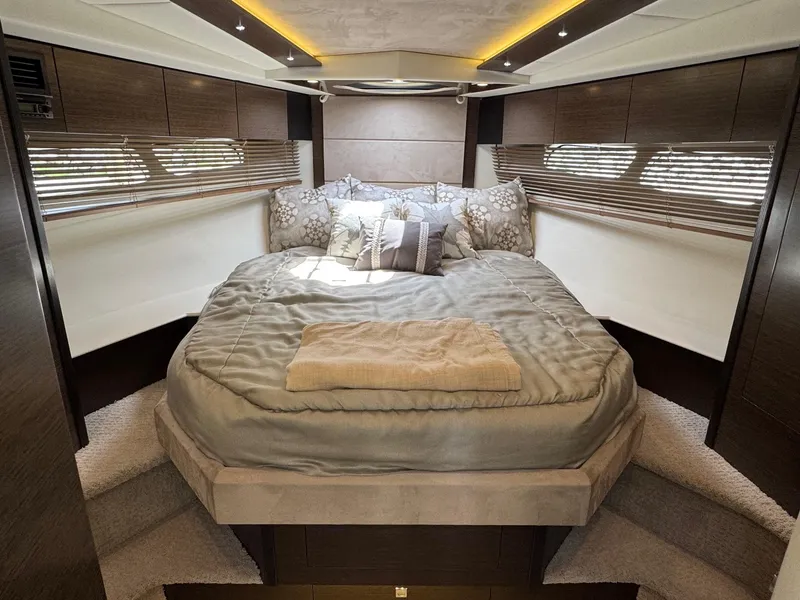 Slide: The Image of Luxurious bedroom interior of 2017 Cruisers Yachts 45 Cantius with elegant bedding and wood accents. - 36