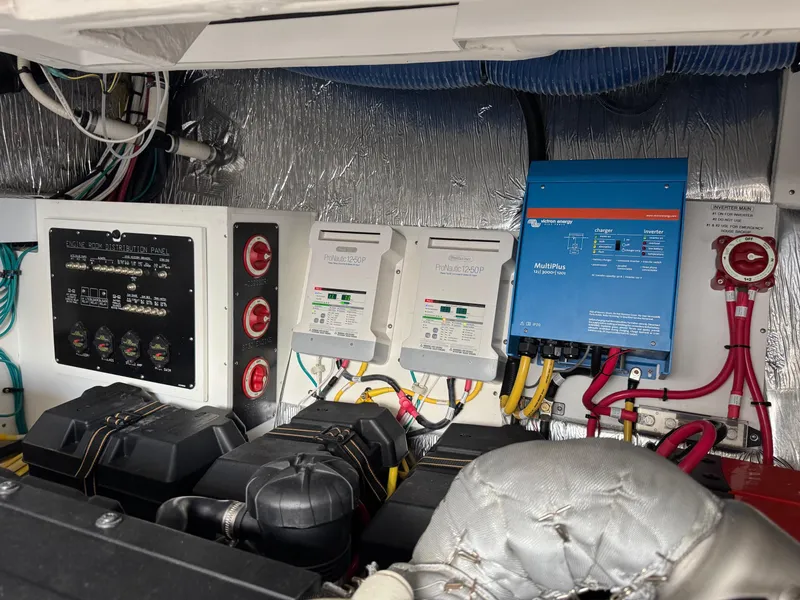 Slide: The Image of Engine room of 2017 Cruisers Yachts 45 Cantius with electrical panels and wiring. - 45