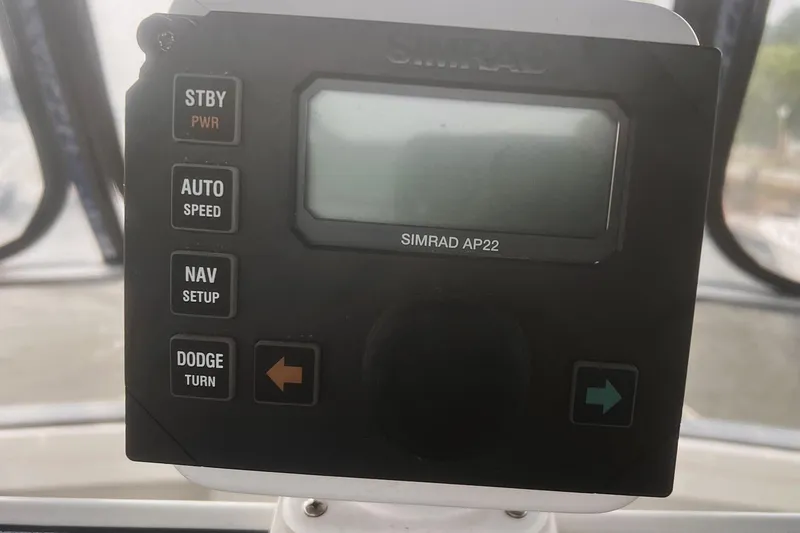 Slide: The Image of Simrad AP22 autopilot control panel on a 1994 Carver 350 boat. - 13