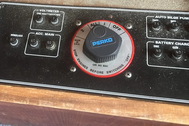 Slide: The Image of Control panel of a 1994 Carver 350 boat with Perko switch and voltmeter. - 18