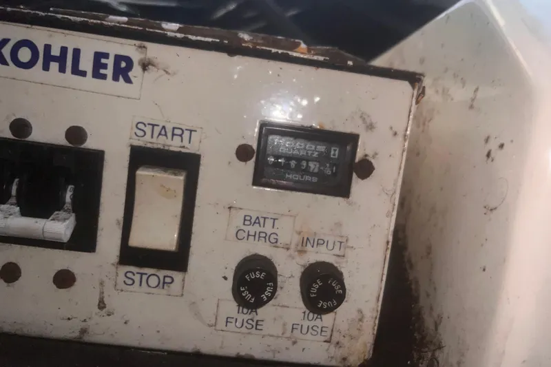 Slide: The Image of Control panel of a Kohler generator on a 1994 Carver 350 boat. - 52