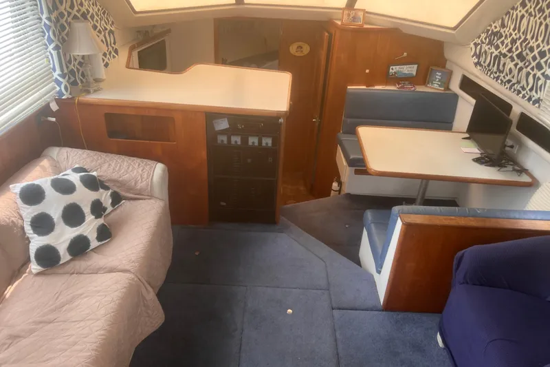 Slide: The Image of Interior of a 1994 Carver 350 yacht with cozy seating and dining area. - 29