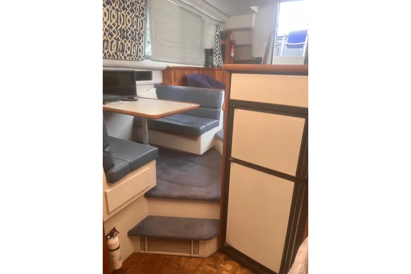 Slide: The Image of Interior of 1994 Carver 350 yacht with dining area and modern decor. - 35