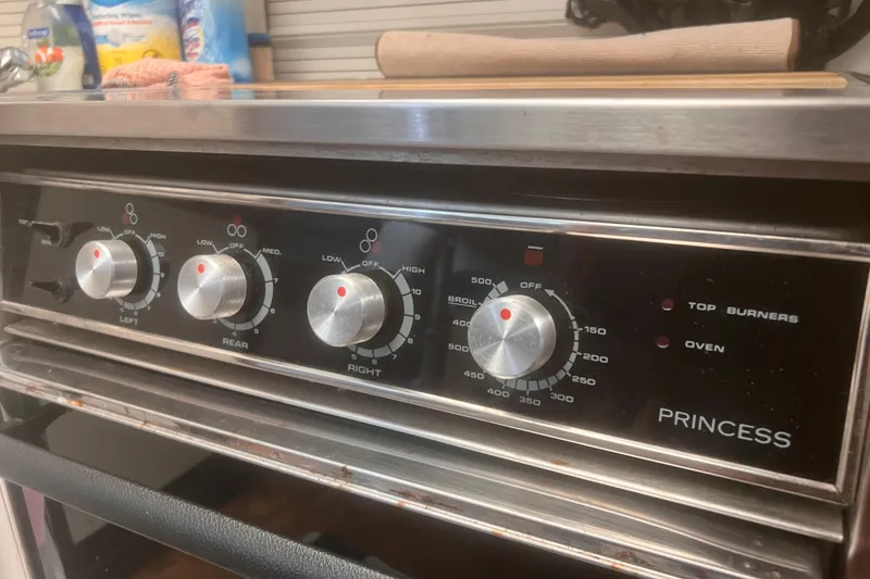 Slide: The Image of 1994 Carver 350 Princess stove control panel with temperature and burner settings. - 40