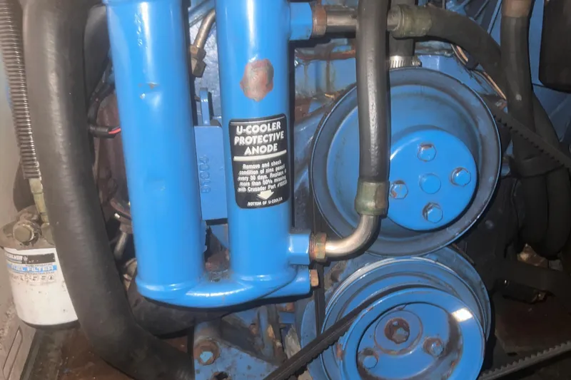 Slide: The Image of 1994 Carver 350 engine with U-cooler protective anode and blue components. - 47