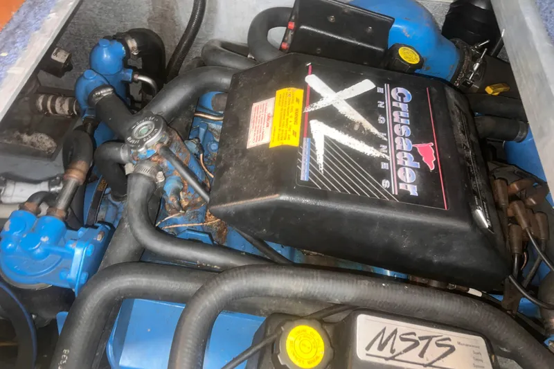 Slide: The Image of Engine of a 1994 Carver 350 boat featuring Crusader XL components. - 49