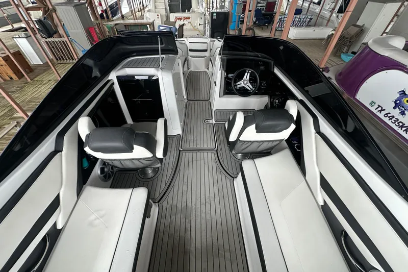 Slide: The Image of 2020 Yamaha Boats 242SE interior with sleek seating and modern dashboard design. - 9