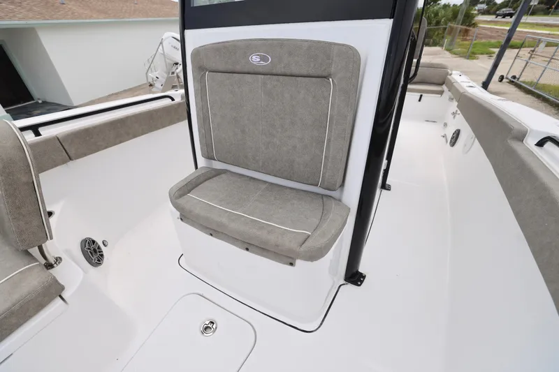 Slide: The Image of 2026 Sea Hunt Ultra 265 SE boat interior with cushioned seating and sleek design. - 18