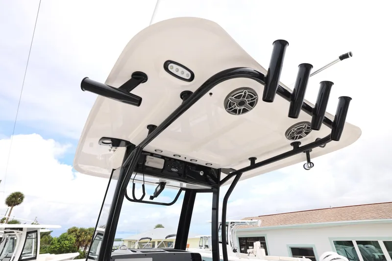 Slide: The Image of 2026 Sea Hunt Ultra 265 SE boat interior with seating and Yamaha cooler. - 3