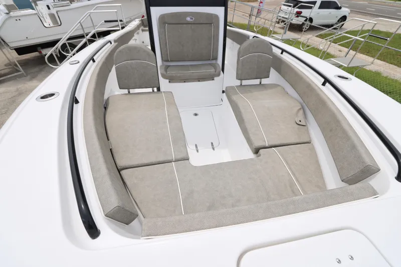 Slide: The Image of 2026 Sea Hunt Ultra 265 SE boat with rod holders and speakers on the T-top. - 5
