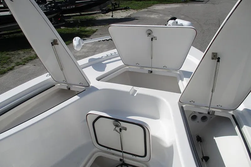 Slide: The Image of 2026 Sea Pro 210 Bay boat with open storage compartments on deck. - 10