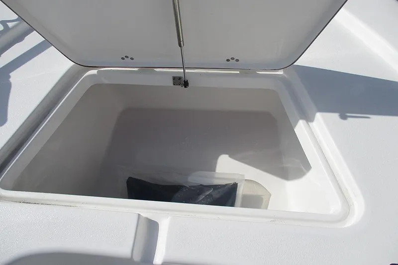 Slide: The Image of Open storage compartment on 2026 Sea Pro 210 Bay boat. - 11