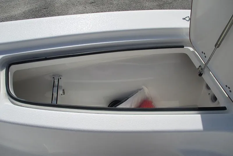 Slide: The Image of Open storage compartment on 2026 Sea Pro 210 Bay boat, showcasing interior space. - 12