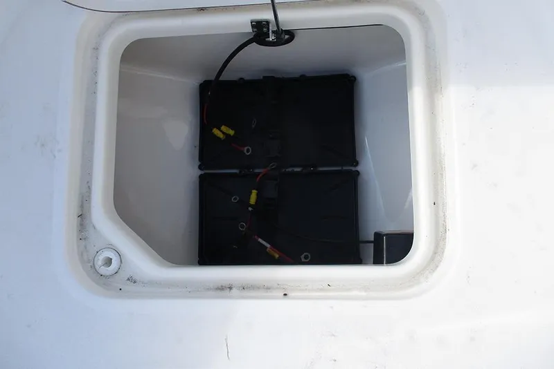 Slide: The Image of Battery compartment of 2026 Sea Pro 210 Bay boat, featuring dual batteries. - 14
