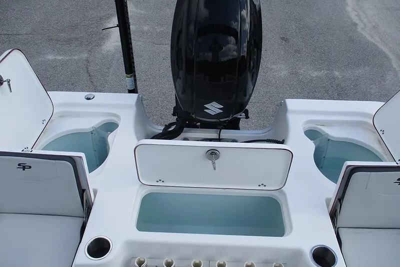 Slide: The Image of 2026 Sea Pro 210 Bay boat with Suzuki outboard motor and storage compartments. - 18